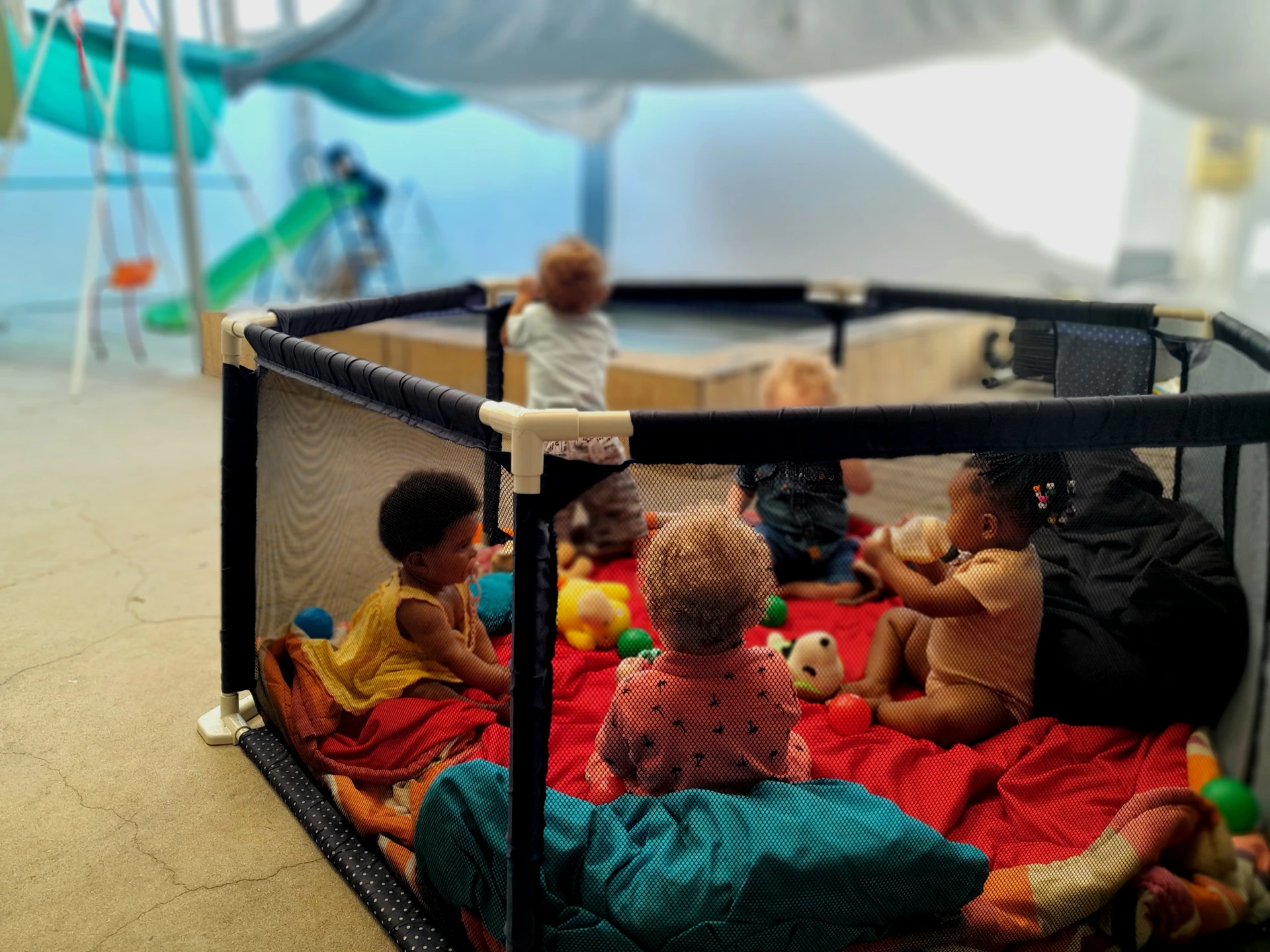 photo of kids in play pen